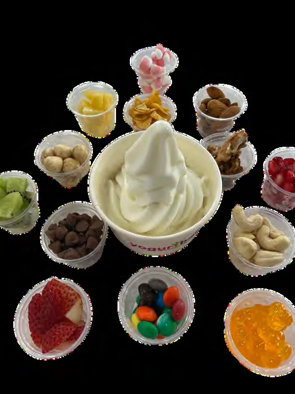 A froyo cup surrounded by topping choices